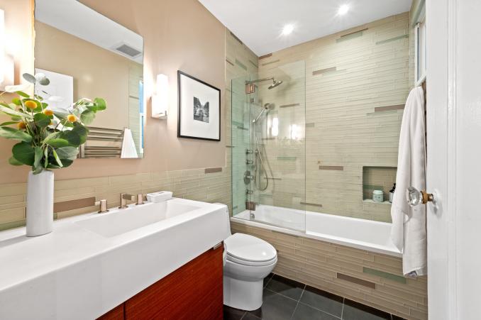 Property Thumbnail: Looking into full bath. Fully updated with glass tile in shower/bath tub. 