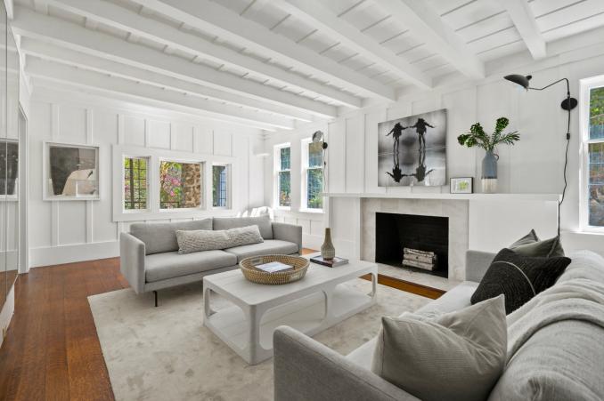 Property Thumbnail: Living room had wood beam detail on ceiling and hardwood floors through out. 