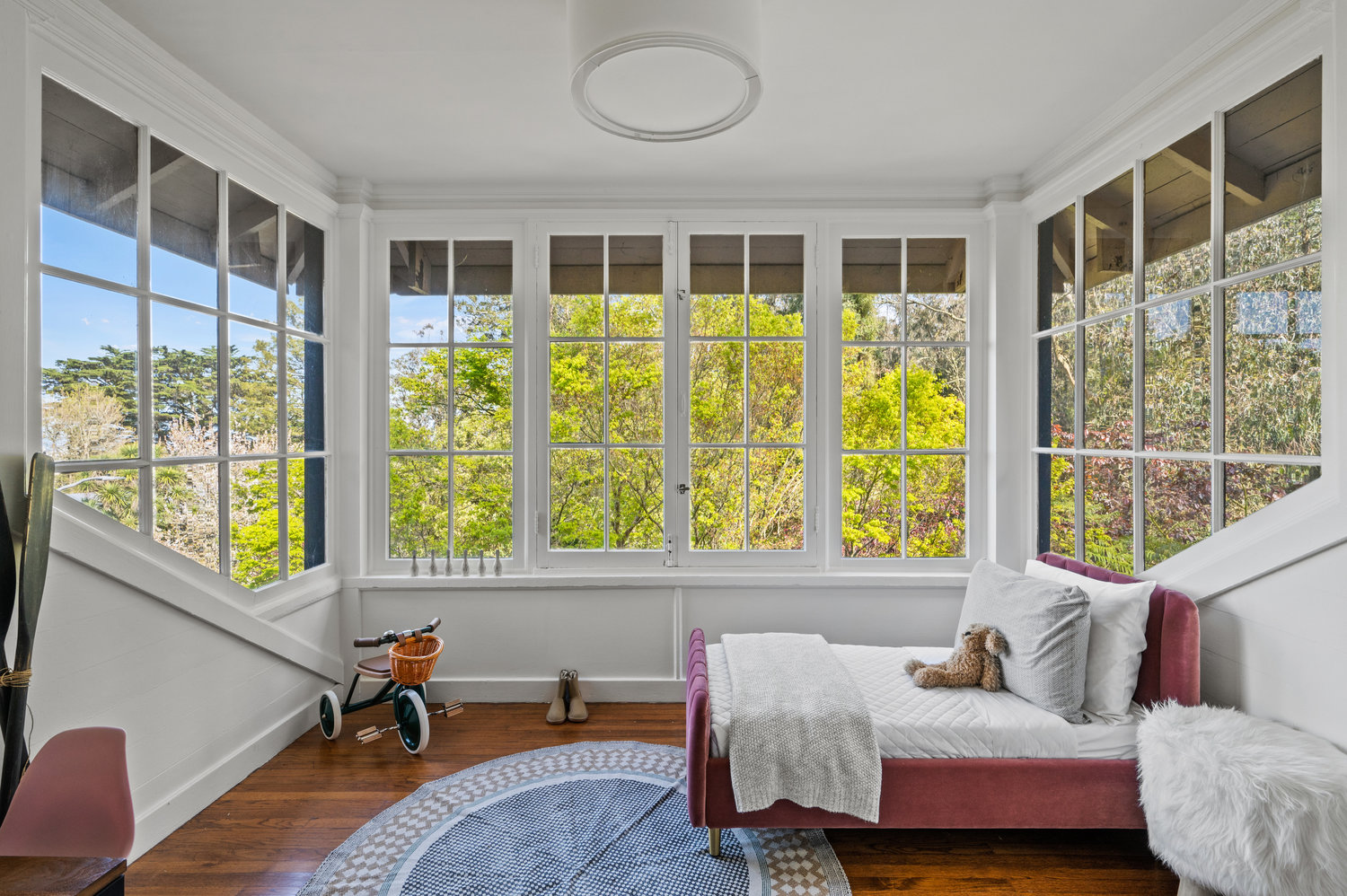 Property Photo: Guest room has large windows on three sides that look out onto Edgewood. 