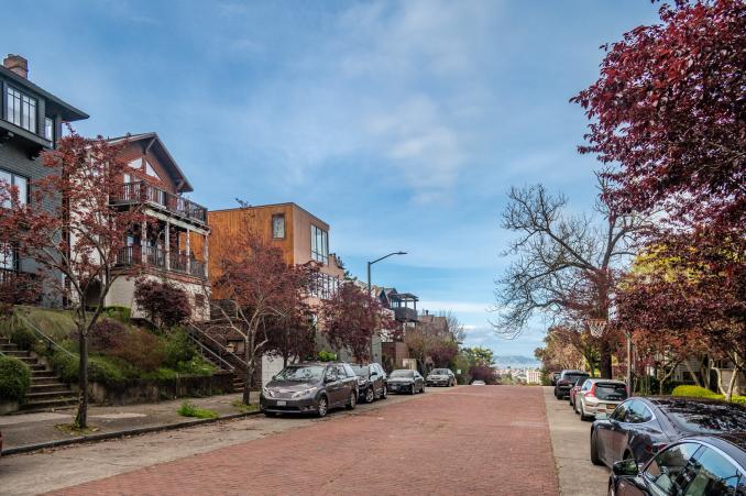 Property Thumbnail: Photo looking down Edgewood. It is a beautiful tree lined brick road. 