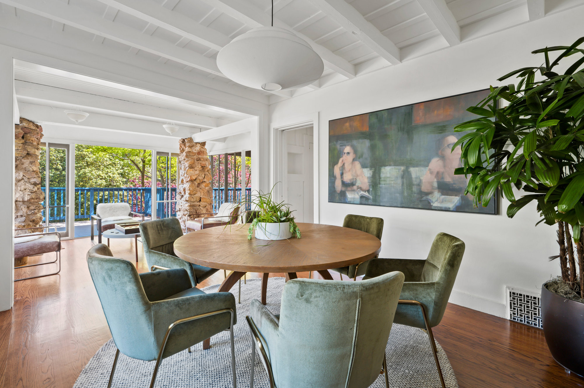 Property Photo: Dining and sitting area off main entry. There is round dining table that seats 5. 