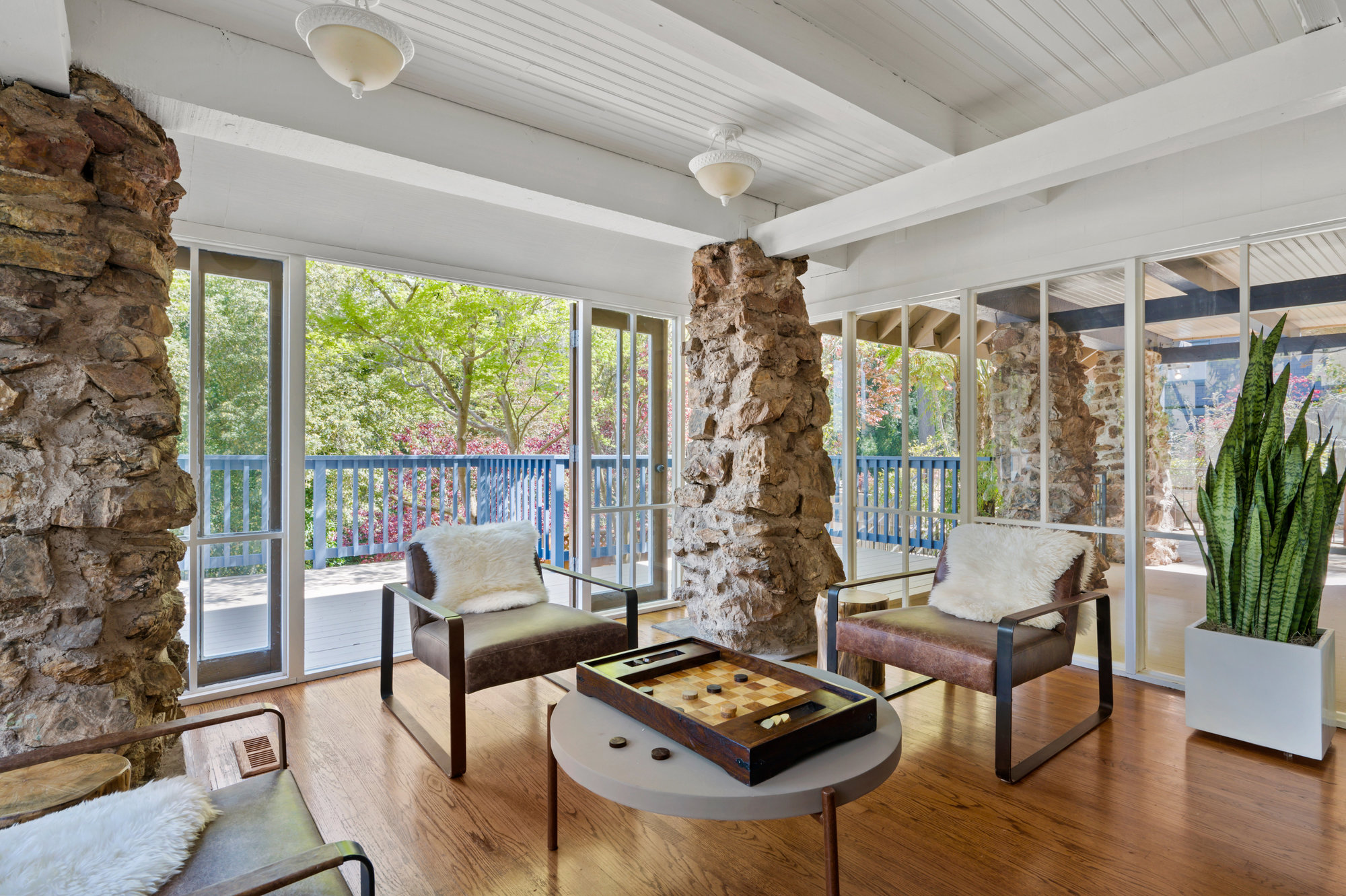 Property Photo: Sitting area that is surrounded by glass windows. 