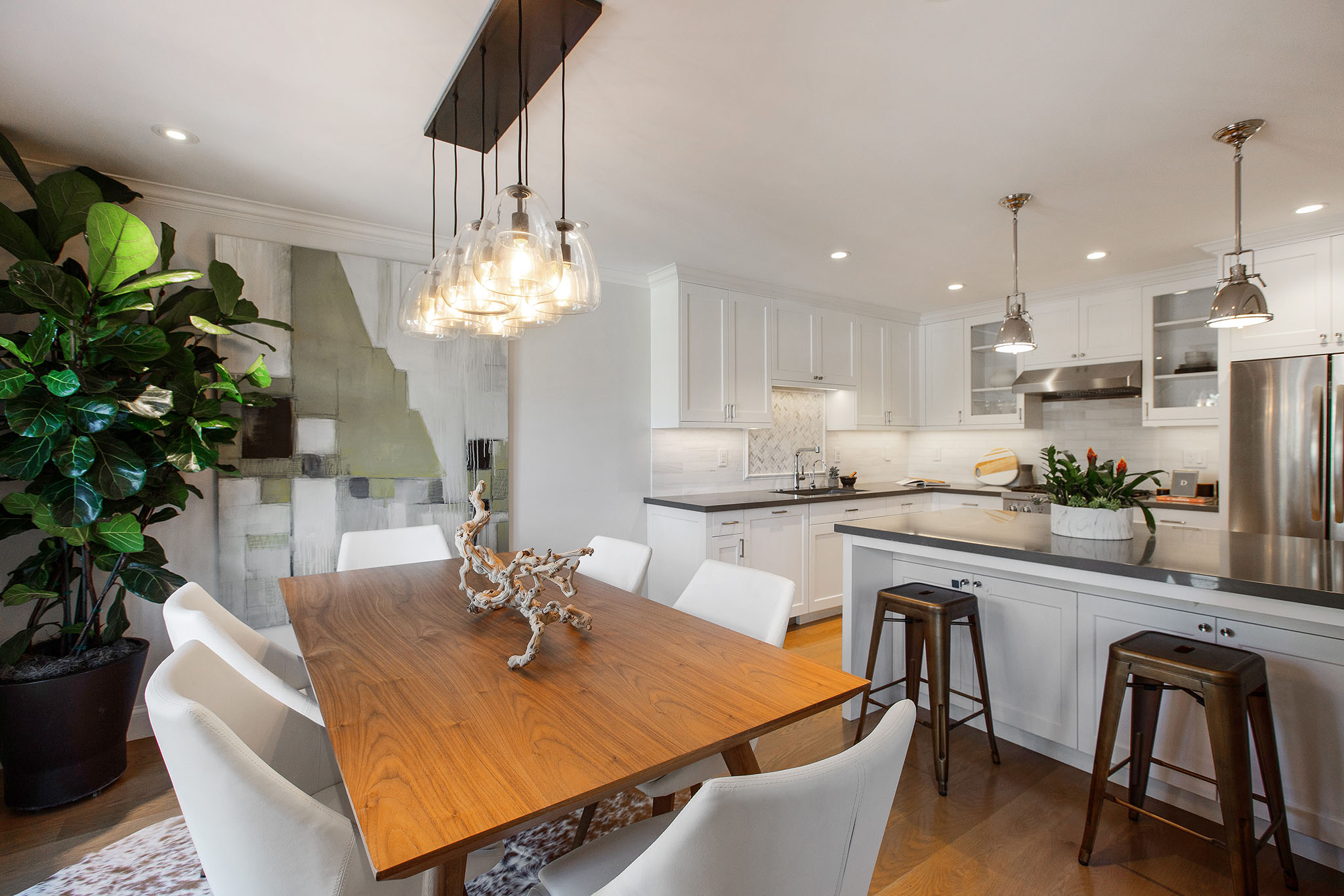 Property Photo: On the dining room side of the kitchen island there are two stools for seating.