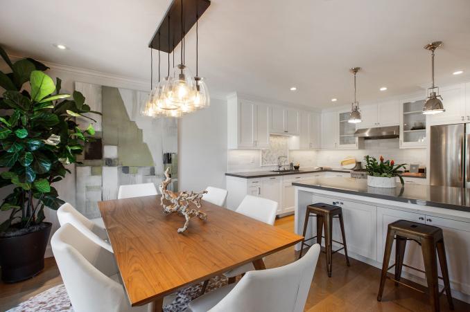 Property Thumbnail: On the dining room side of the kitchen island there are two stools for seating.