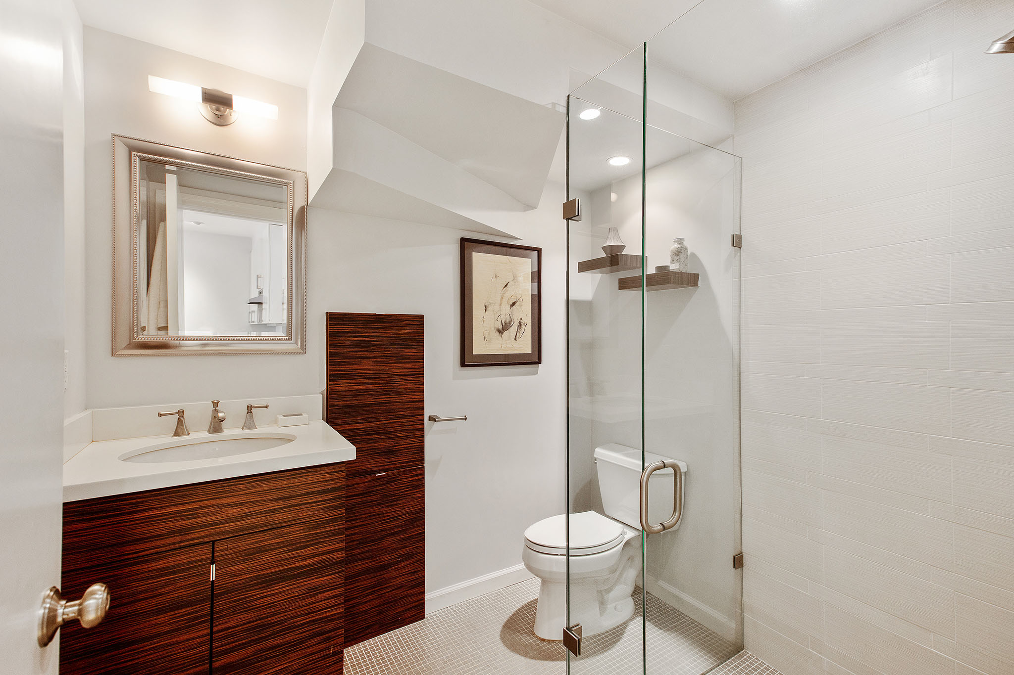 Property Photo: The second bathroom has stand alone shower, toilet and one sink vanity. 