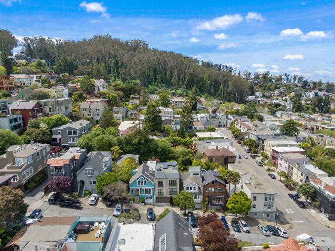 Property Thumbnail: Aerial shot further away from 1523 Cole Street with Sutro Forest in the background. 