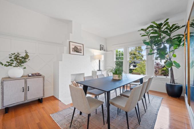 Property Thumbnail: Looking into dining room from entry. There is a large rectangular table that seats 10. 