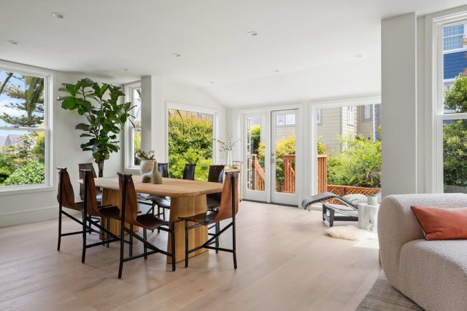 Property Thumbnail: There is a large oval dining table and then there is a sitting area in the backside of room. 
