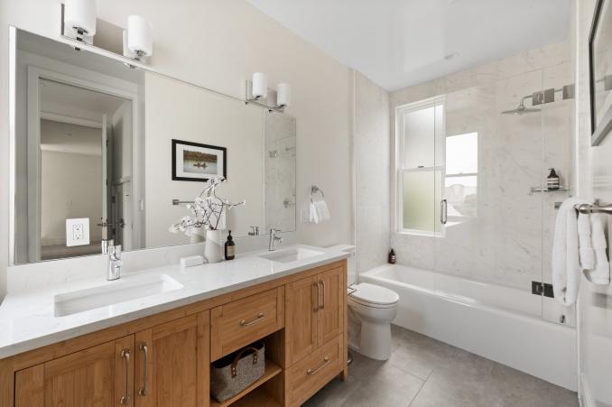Property Thumbnail: Bathroom has double vanity and tub/shower combo. There are two windows in bathroom. 