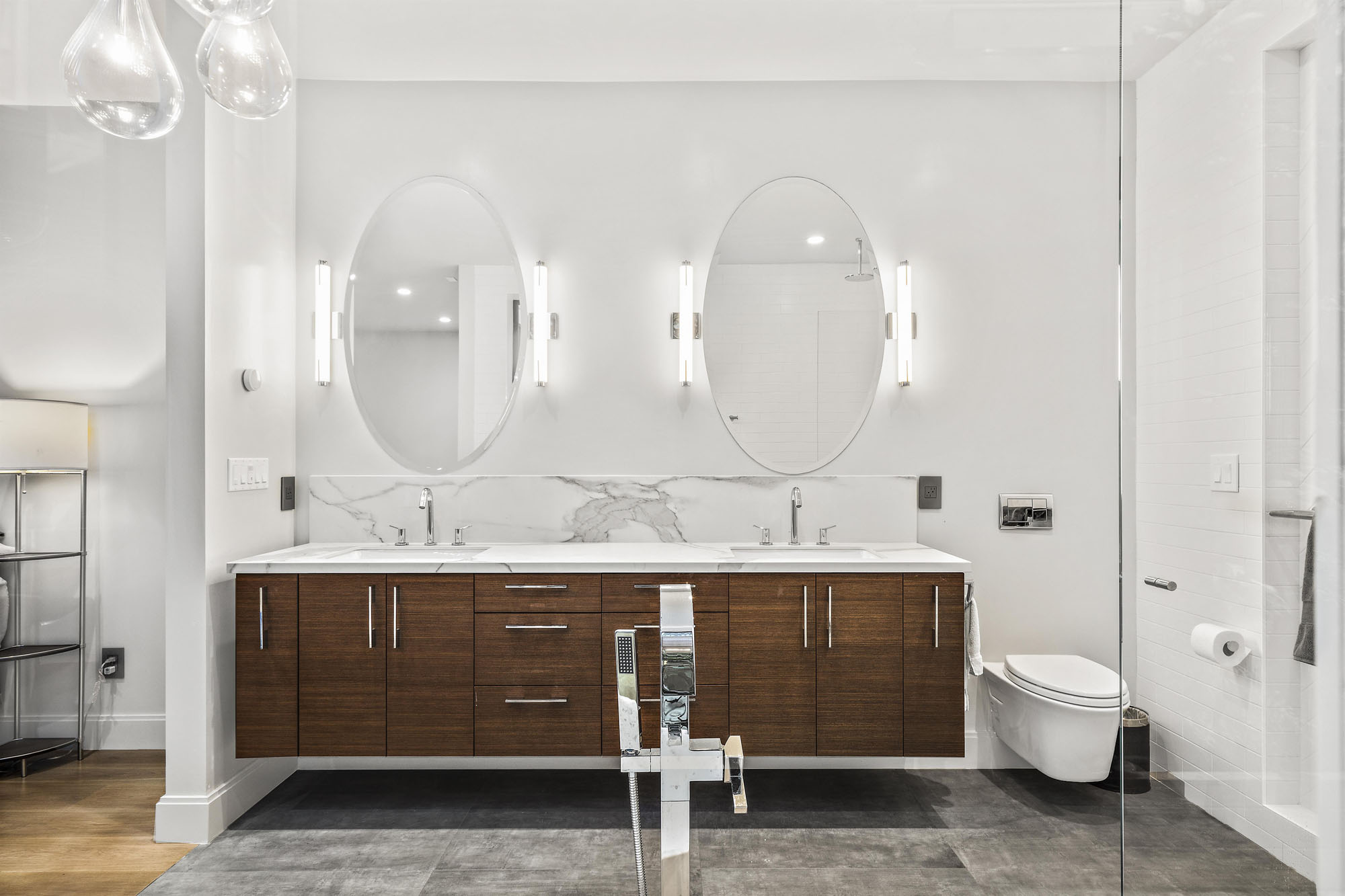 Property Photo: There is a double vanity with double mirrors in primary bathroom. 