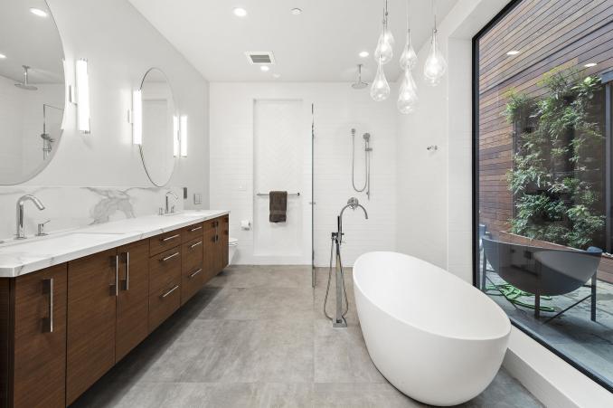 Property Thumbnail: There is a large soaking tub and stand up shower with glass doors. All updated and modern features. 