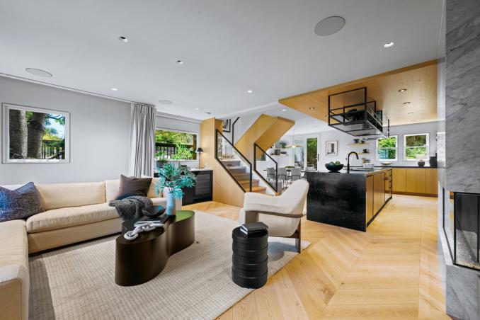 Property Thumbnail: First level is open floor plan. This photo is looking over the livingroom from the front door.