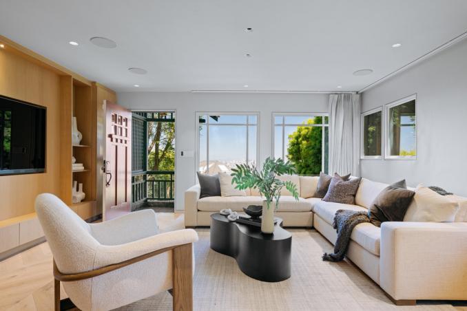 Property Thumbnail: There are large windows in the living room that lets in lots of natural light.