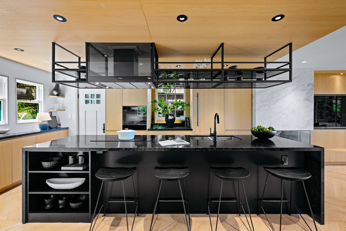 Property Photo: The kitchen island has seating area that sits 4 and has some built in shelves.