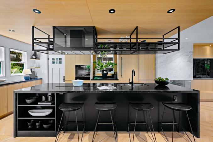 Property Thumbnail: The kitchen island has seating area that sits 4 and has some built in shelves.