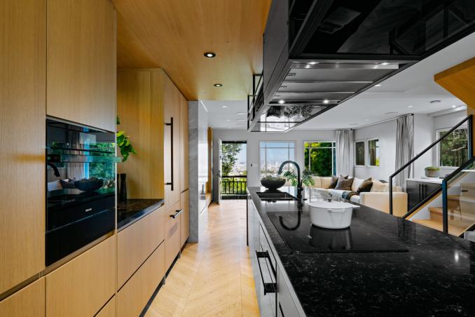 Property Thumbnail: Kitchen has chevron floors that go into the kitchen.