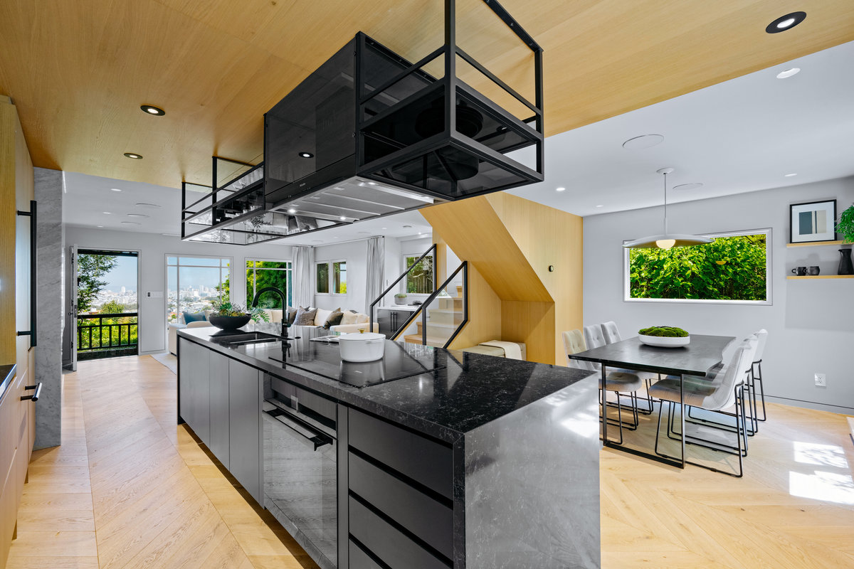 Property Photo: Looking over kitchen to the dining space. There is a nice large window that lets in lots of light.