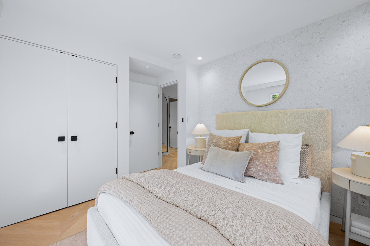 Property Photo: Guest bed also has the chevron wooden floors throughout.