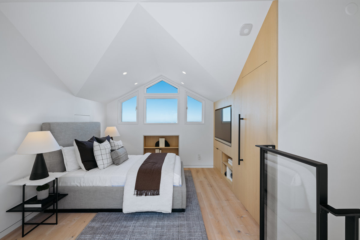 Property Photo: Third bedroom is on the top level. There are vaulted ceilings and beautiful views of down town.