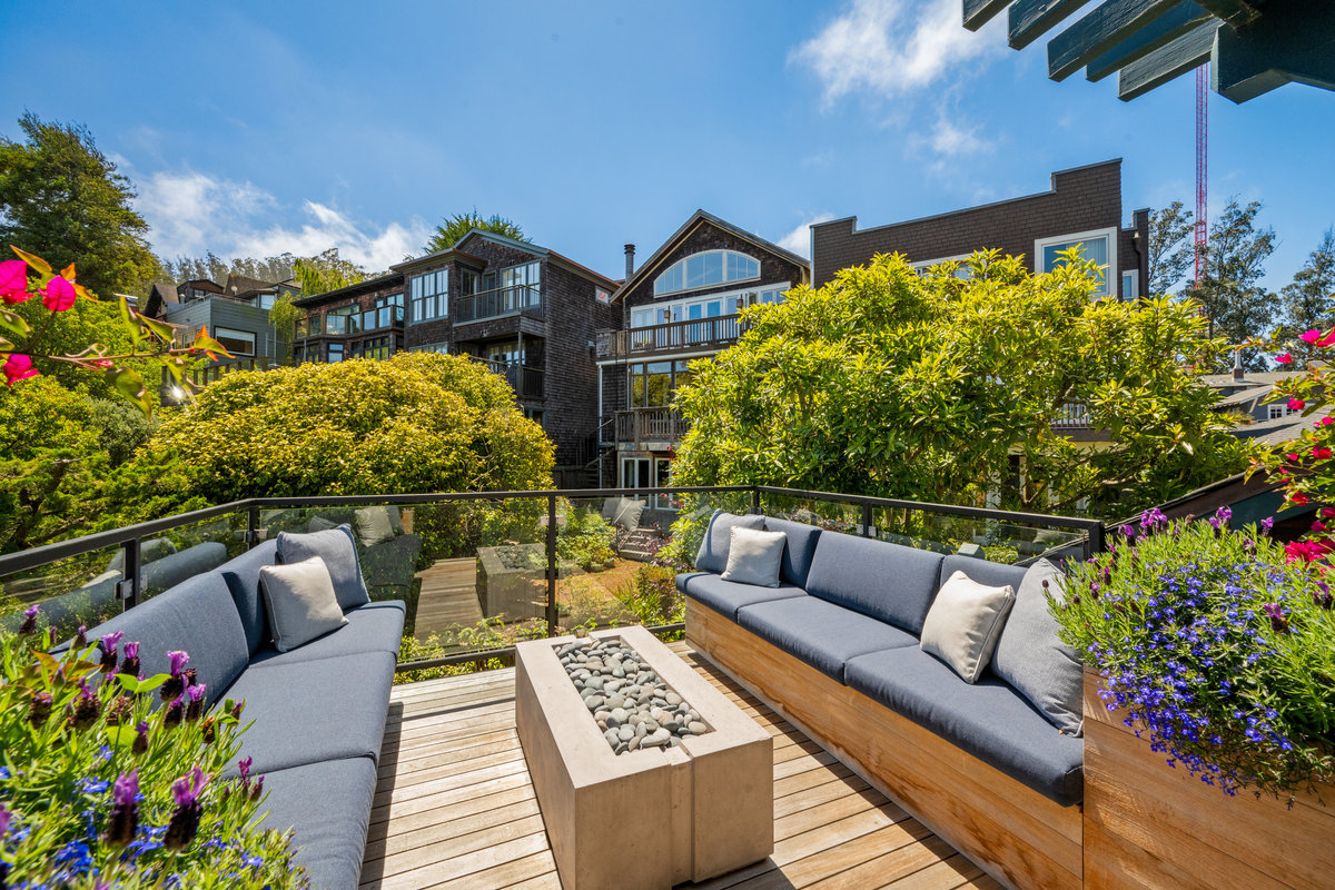 Property Photo: Back deck has gas fireplace and built in benches on each side.