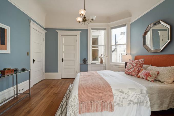 Property Thumbnail: Bedroom with wood floors and white wood trim