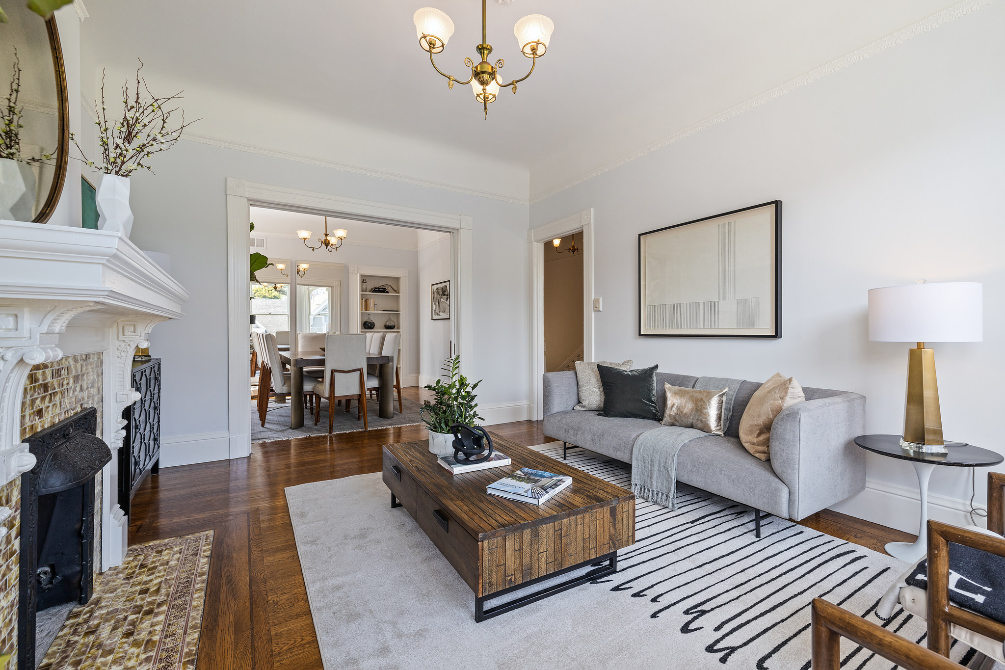 Property Photo: Living room at 454 Frederick Street, featuring wood floors and a fireplace