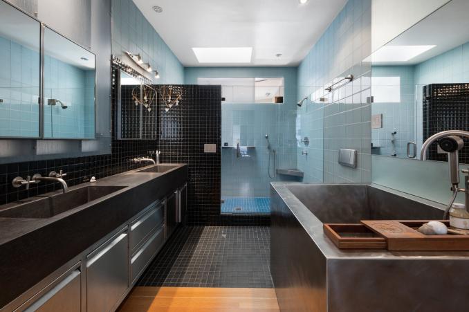Property Thumbnail: View of a large bathroom with soaking tub, double vanity, and glass shower