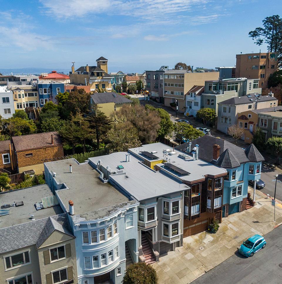 A view of Belvedere Street in Cole Valley, San Francisco, featuring large homes