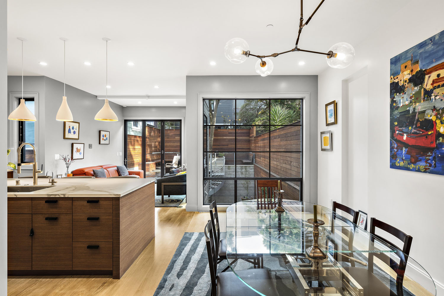 Kitchen and dining area at 858 Ashbury, showing a large open-floor-plan room with floor to ceiling windows