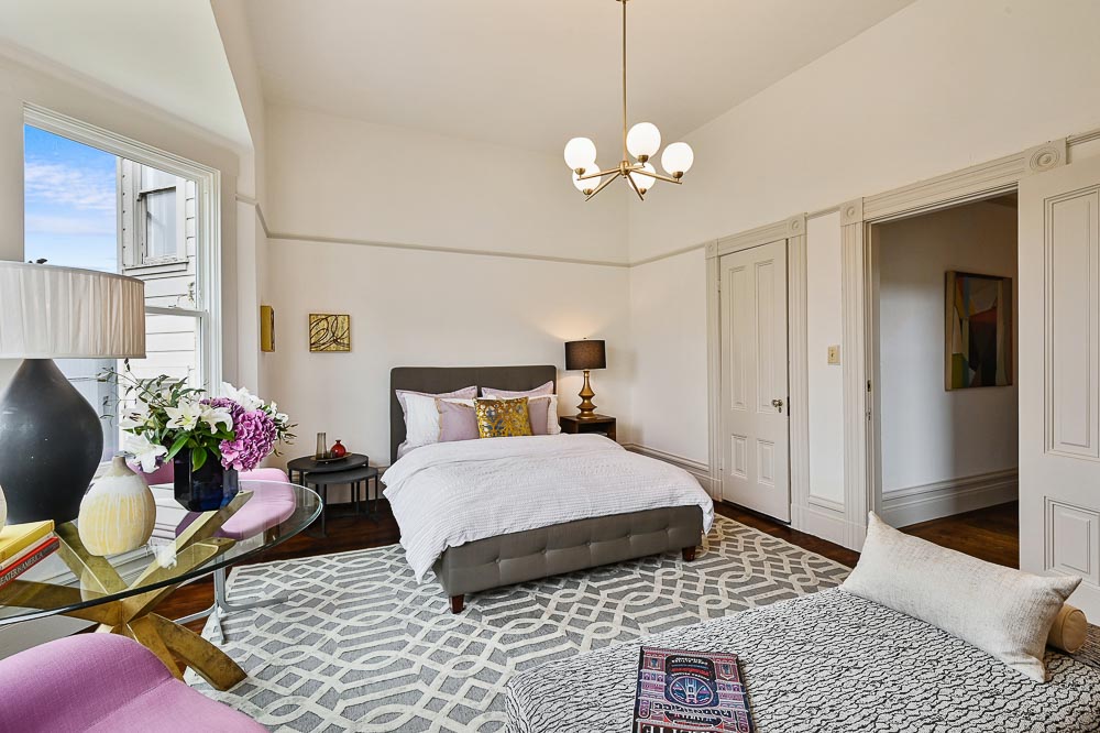 Property Photo: View of another bedroom, showing wood floors