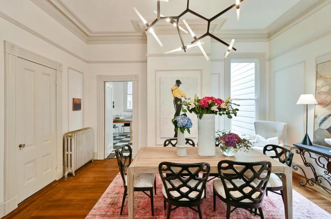 Property Thumbnail: View of the formal dining room, featuring wood floors and crown moulding 