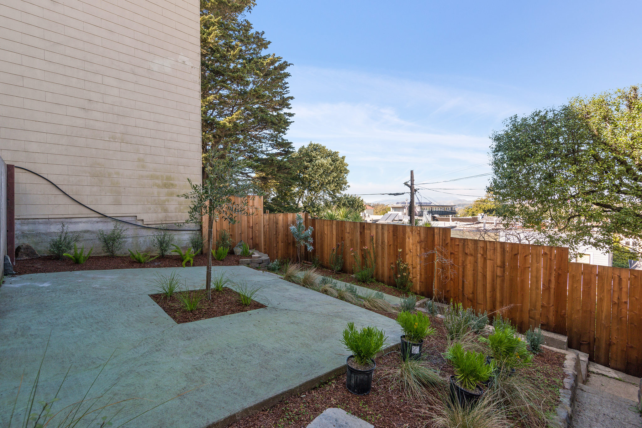 Property Photo: Exterior view of the outdoor space, featuring a wood fence