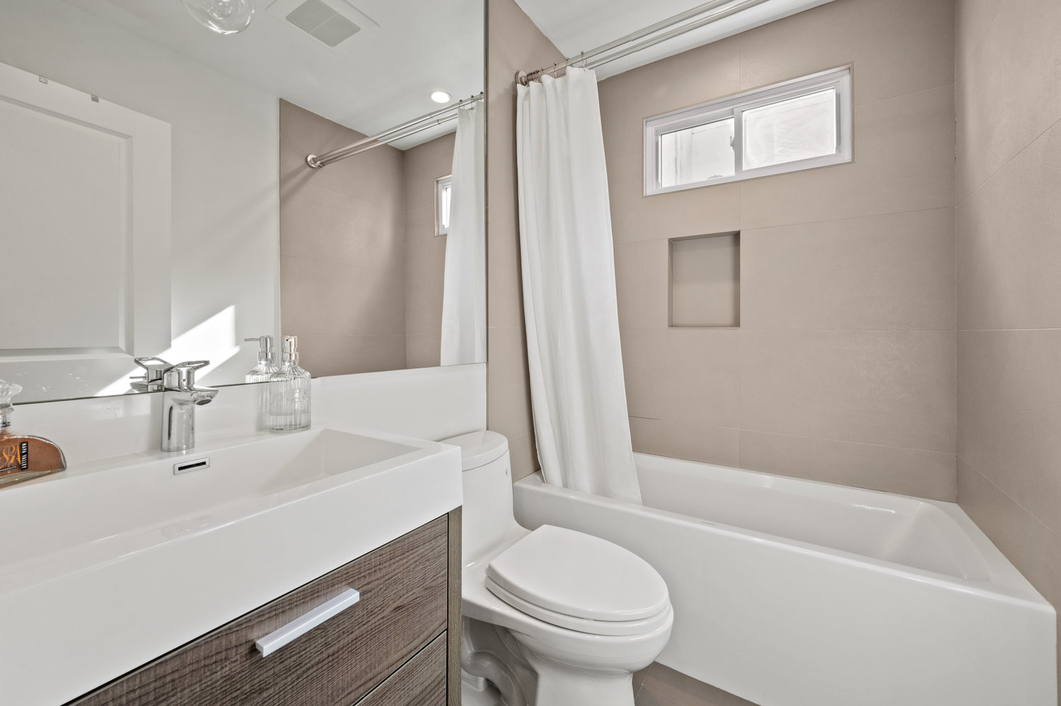 Property Photo: Bathroom with tub and modern vanity 