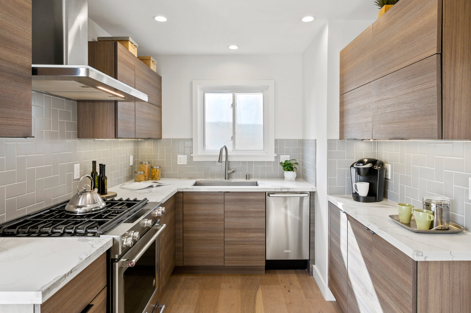 Property Photo: Chef's kitchen with high-end appliances and lux cabinetry 