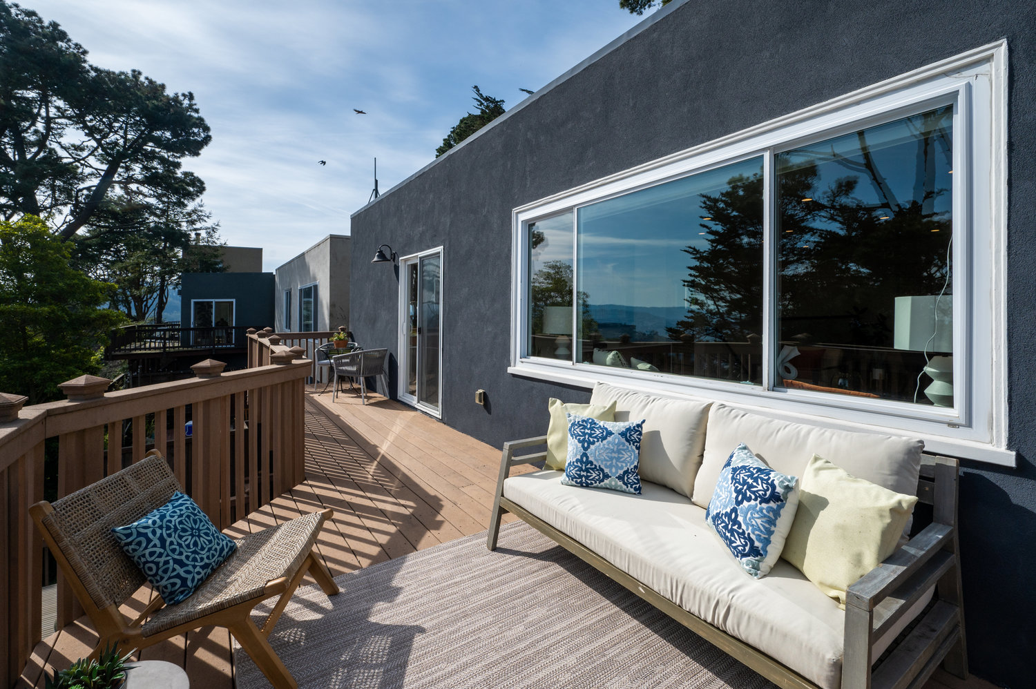 Property Photo: Sunny outdoor living space, via the top deck at 156 Midcrest