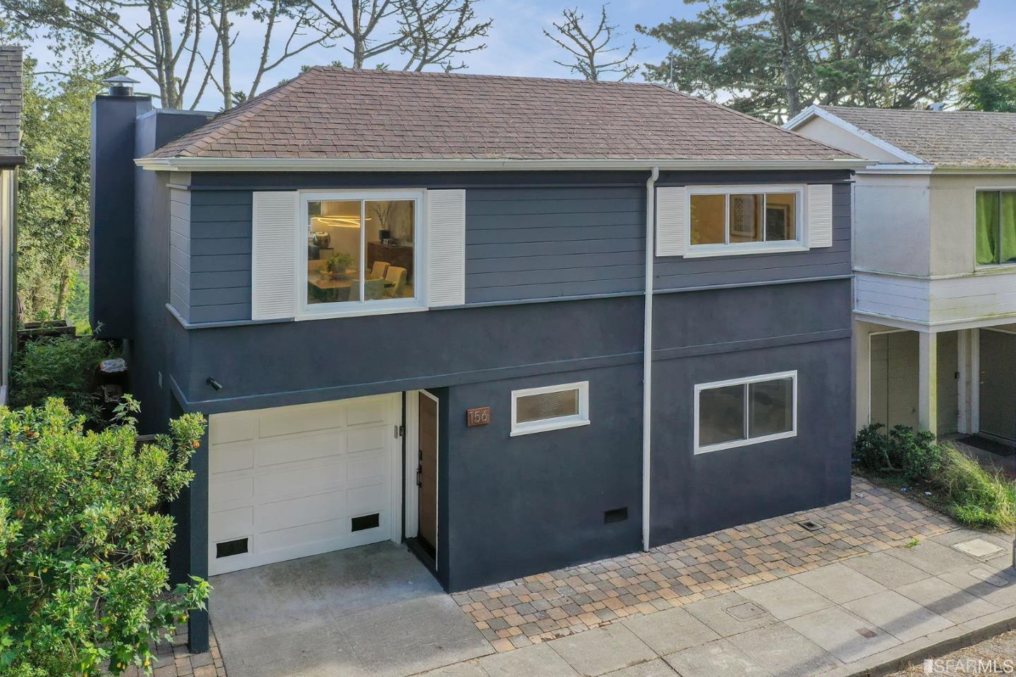 Property Photo: Front facade of mid-century modern home, 156 Midcrest Way