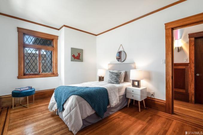 Property Thumbnail: Bedroom three, featuring wood floors and plenty of natural light