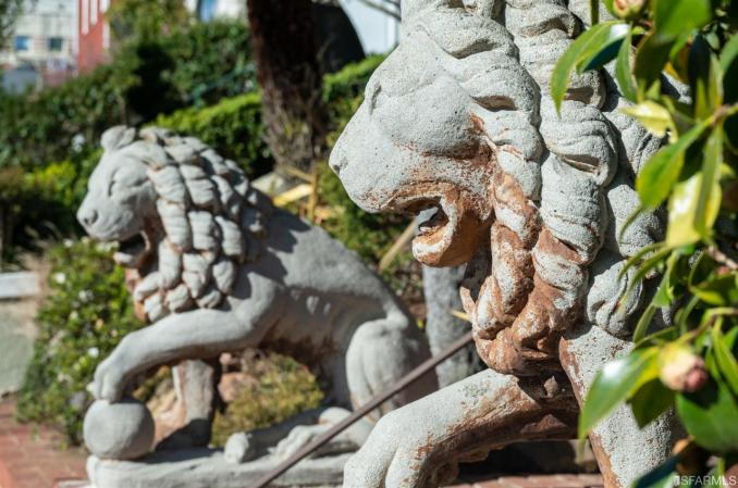 Property Thumbnail: Close-up view of two stone lions found outside 2212 Lake Street