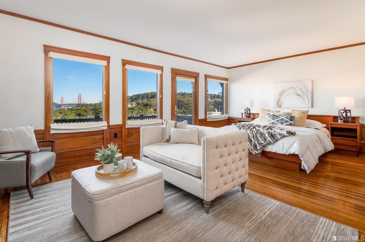 Property Photo: Primary suite with four large windows with sweeping views of San Francisco
