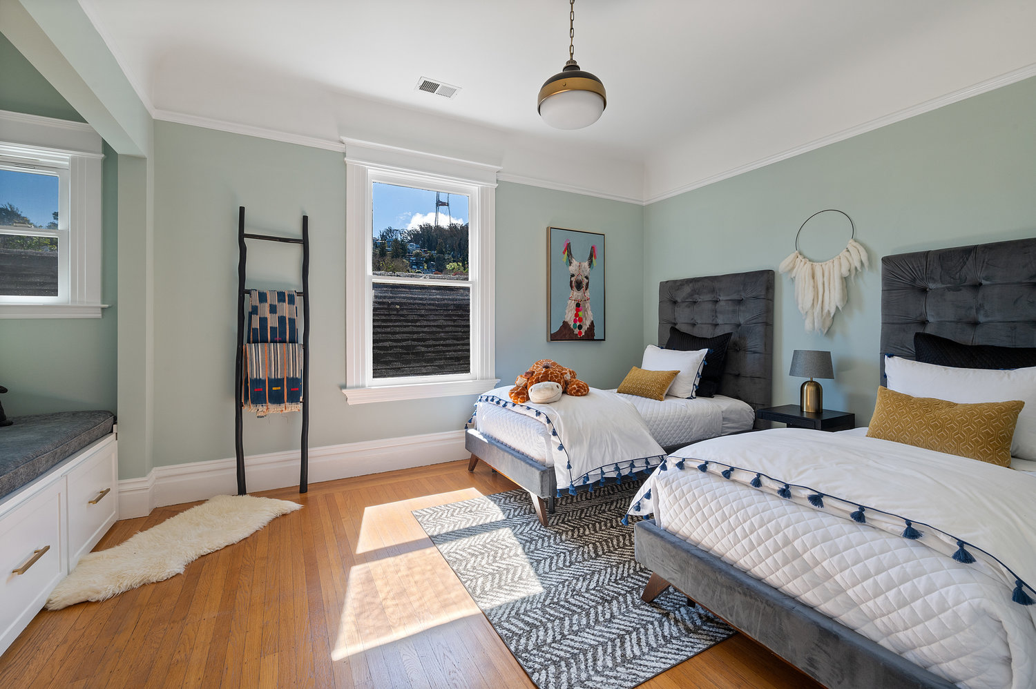Property Photo: Bedroom three featuring wood floors 