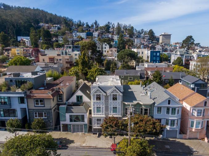 Property Thumbnail: Aerial view of 1223 Shrader Street, showing a three story home in Cole Valley
