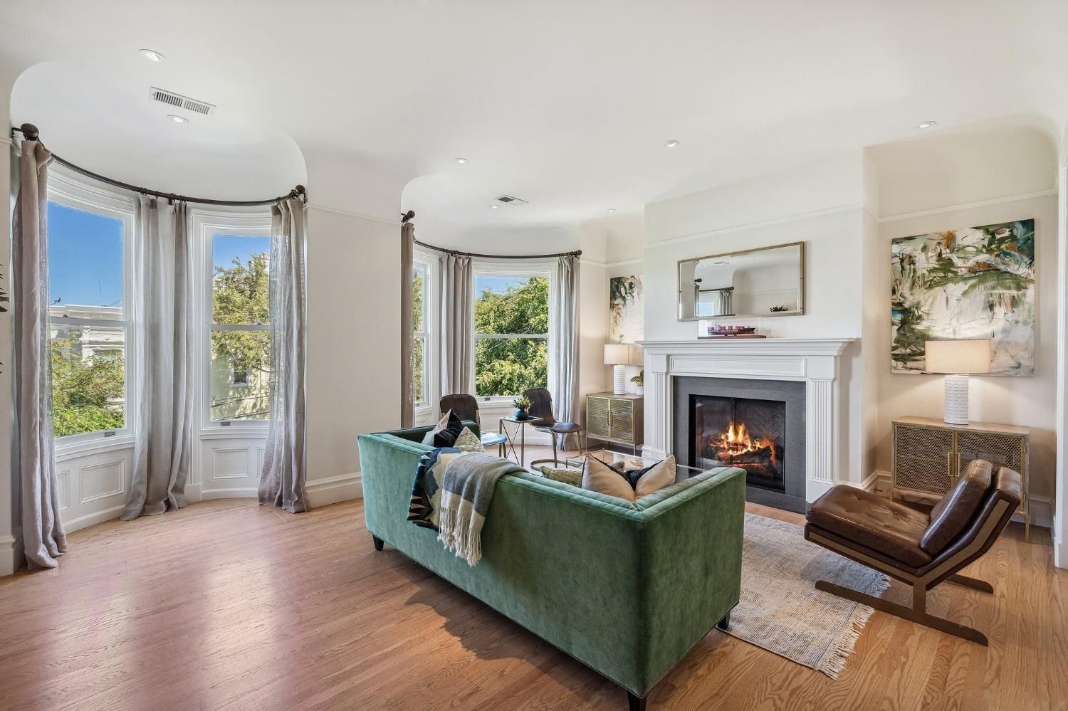 View of a home purchased off-market, showing a large room with fireplace