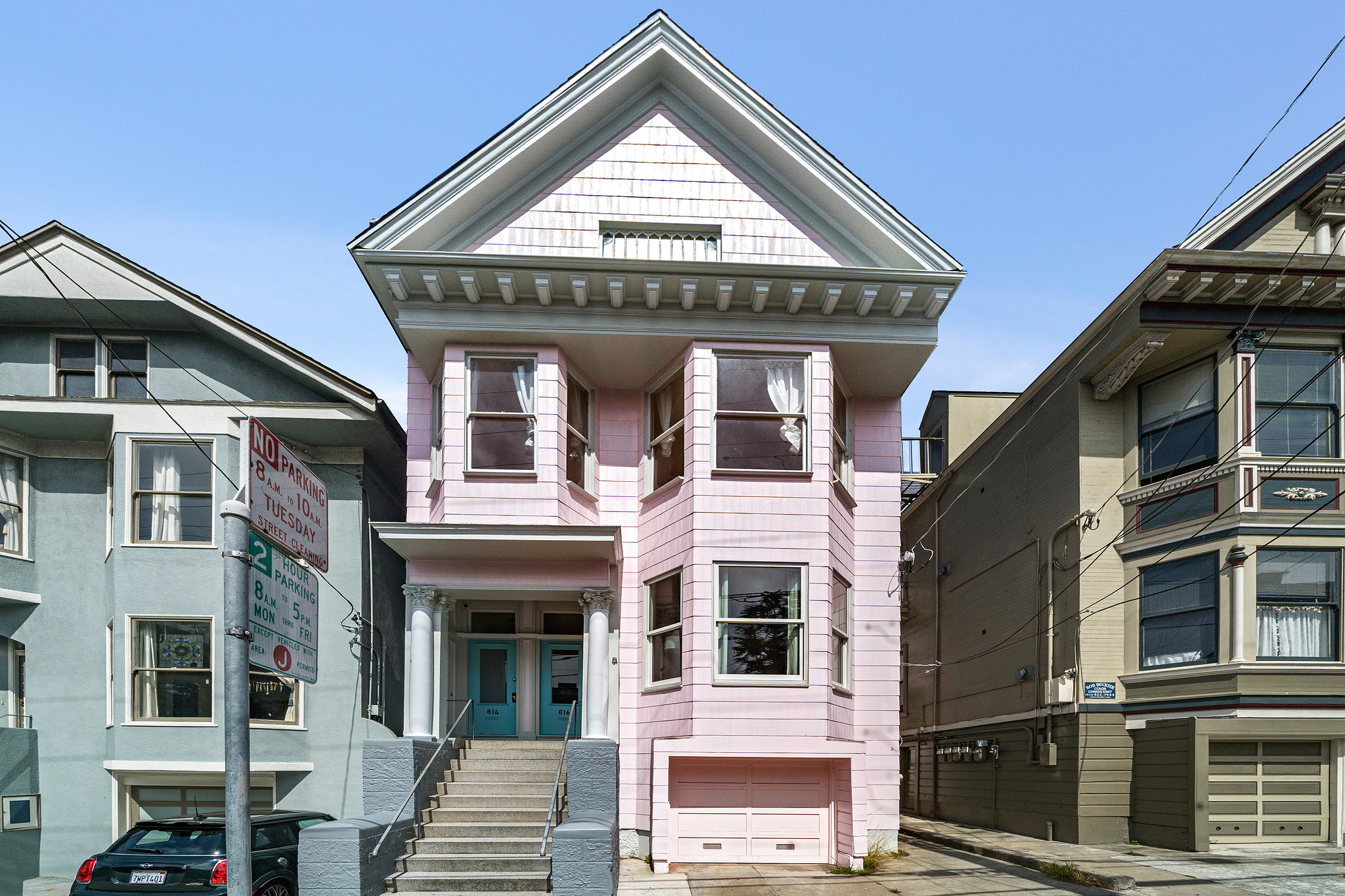 Property Photo: Exterior view of 814-816 Cole Street, featuring a pink facade