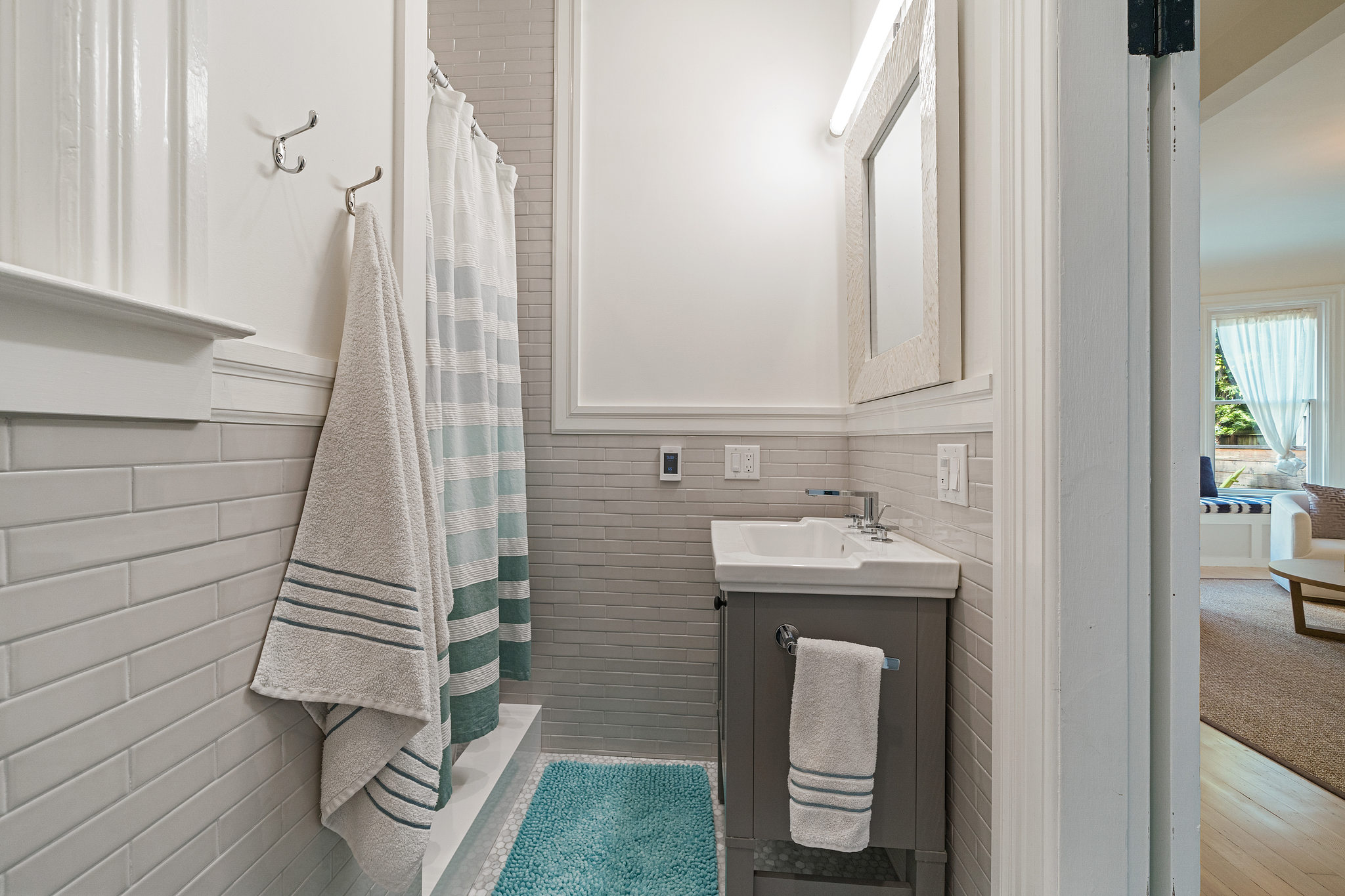 Property Photo: Bathroom with light grey tile