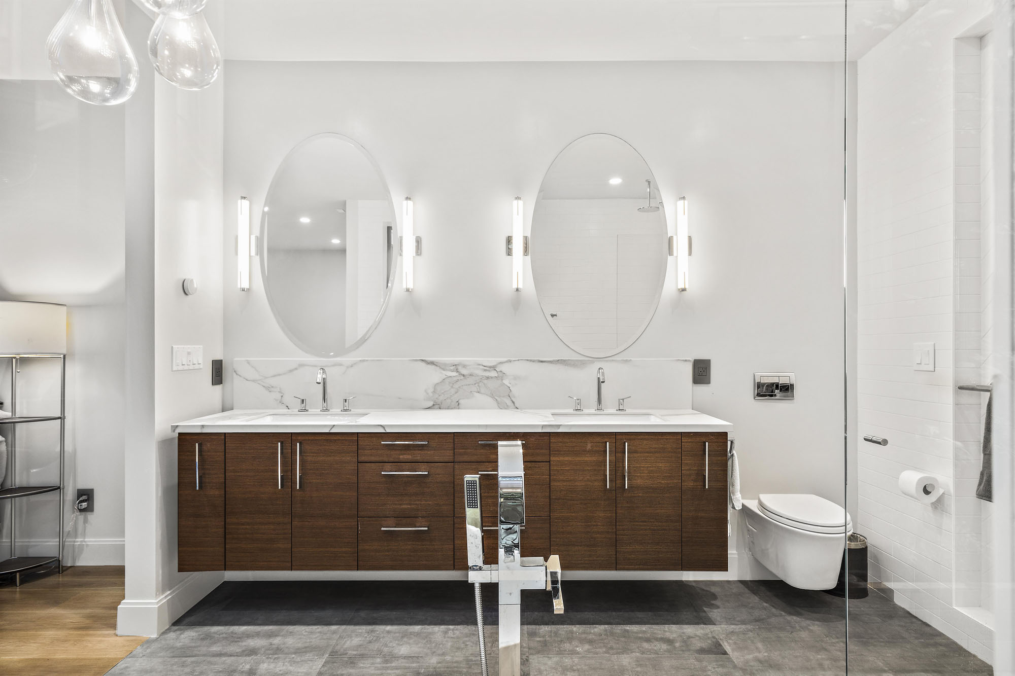 Property Photo: There is a double vanity with double mirrors in primary bathroom.