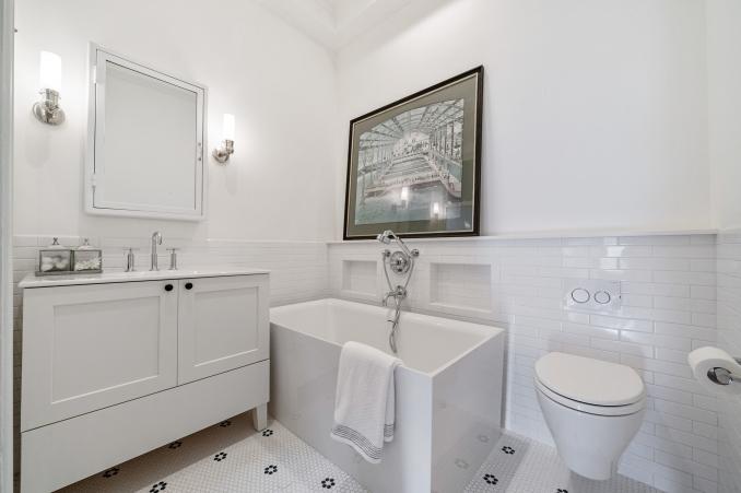 Property Thumbnail: Bathroom with large tub and white cabinet