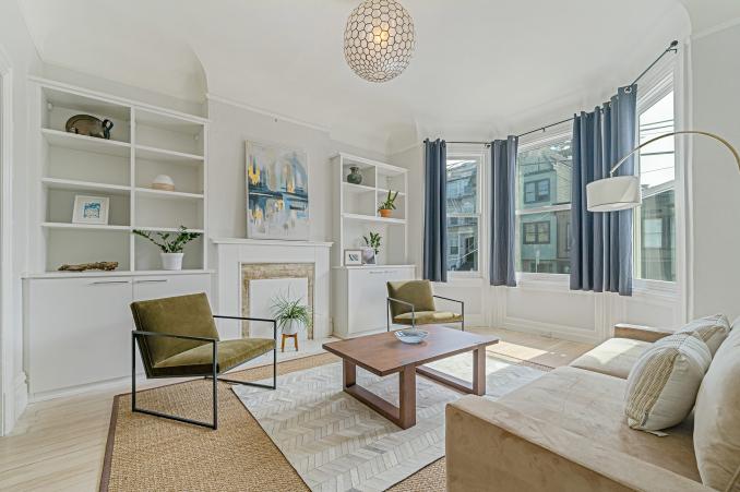 Property Thumbnail: Living room with white built-in cabinets 