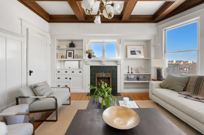 Property Thumbnail: Back living room has built ins on both sides on fireplace. There is a window above fireplace that looks out to Cole Valley.