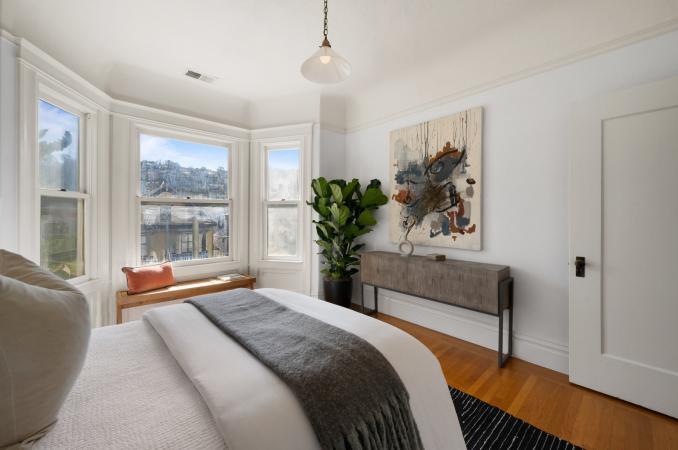 Property Thumbnail: Guest bedroom in front of unit. Has bay windows that look out to Parnassus Ave.