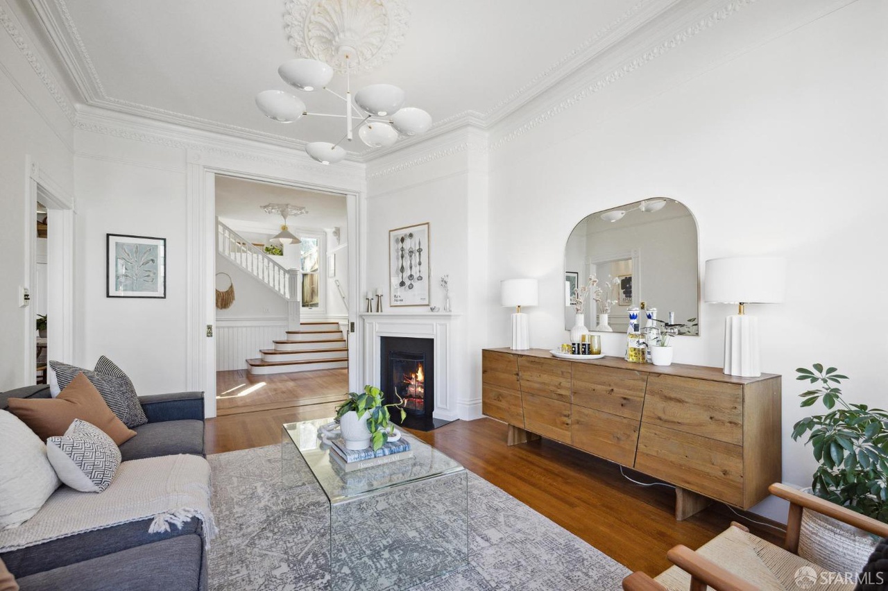 Property Photo: Looking over the living room to main entry. 